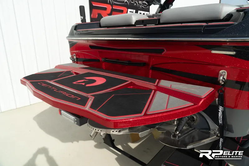 Slide: The Image of 2024 Centurion Ri245 boat rear view with red detailing and swim platform. - 40