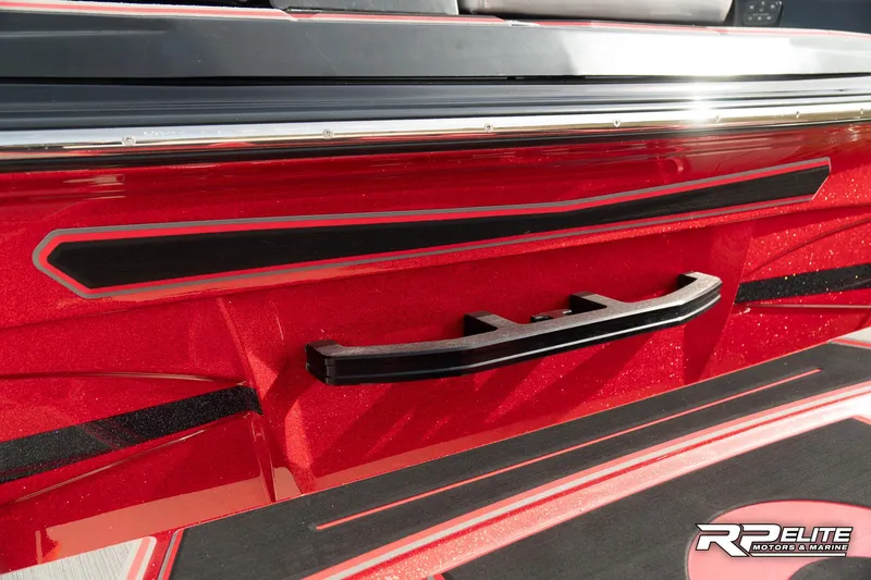 Slide: The Image of 2024 Centurion Ri245 boat, red exterior with black accents, RP Elite branding. - 41
