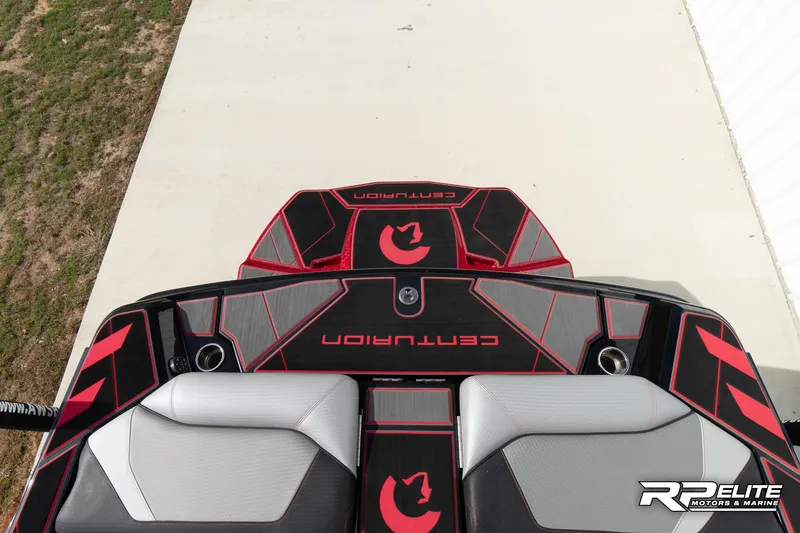 Slide: The Image of 2024 Centurion Ri245 boat interior with red and black design, featuring logo and branding. - 45