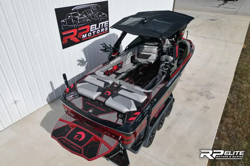 Slide: The Image of 2024 Centurion Ri245 boat at RP Elite Motors, showcasing sleek design and luxury features. - 6