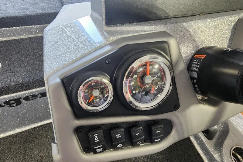 Slide: The Image of Dashboard of 2025 Ranger Z185 boat with gauges and control switches. - 8