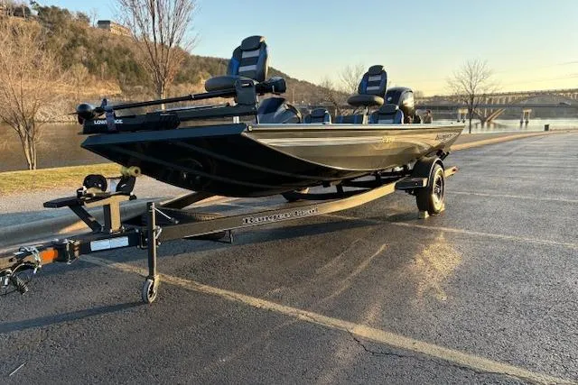 Slide: The Image of 2025 Ranger RT178 boat on trailer, parked near a scenic waterfront. - 123