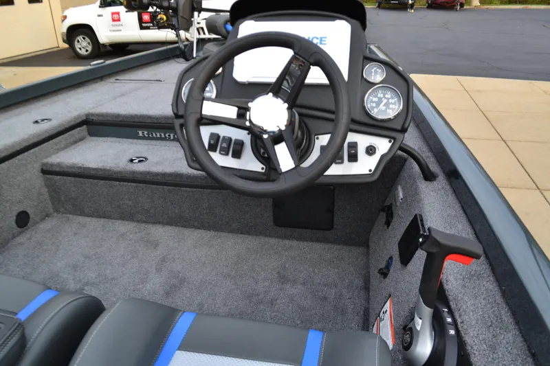 Slide: The Image of 2025 Ranger RT178 boat cockpit with steering wheel and dashboard controls. - 3