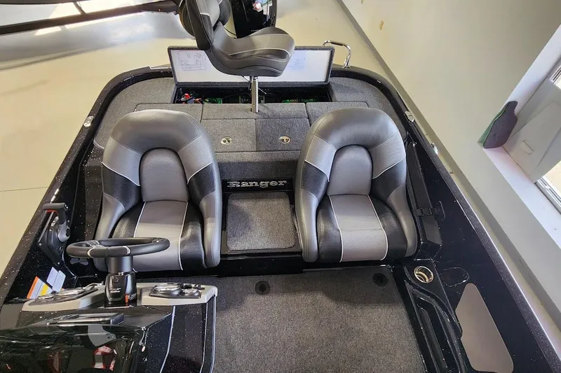 Slide: The Image of 2025 Ranger Z185 boat interior with dual seats and steering console. - 6