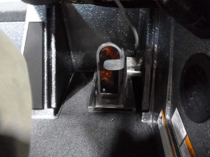 Slide: The Image of Foot pedal area of 2025 Ranger Z520 boat, featuring textured flooring and control components. - 11