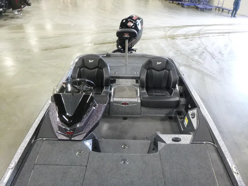 Slide: The Image of 2025 Ranger Z520 boat interior with dual seats and steering console. - 16