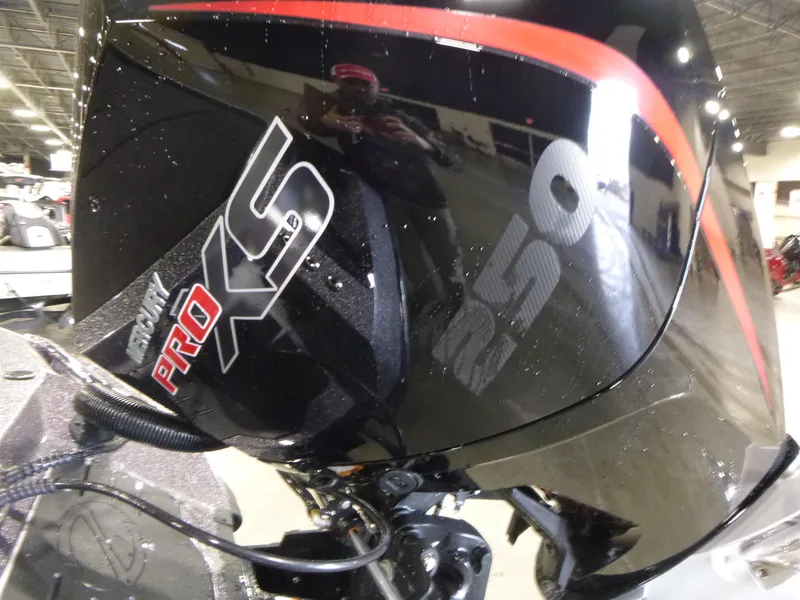 Slide: The Image of 2025 Ranger Z520 boat engine, featuring Pro XS branding in a showroom setting. - 17