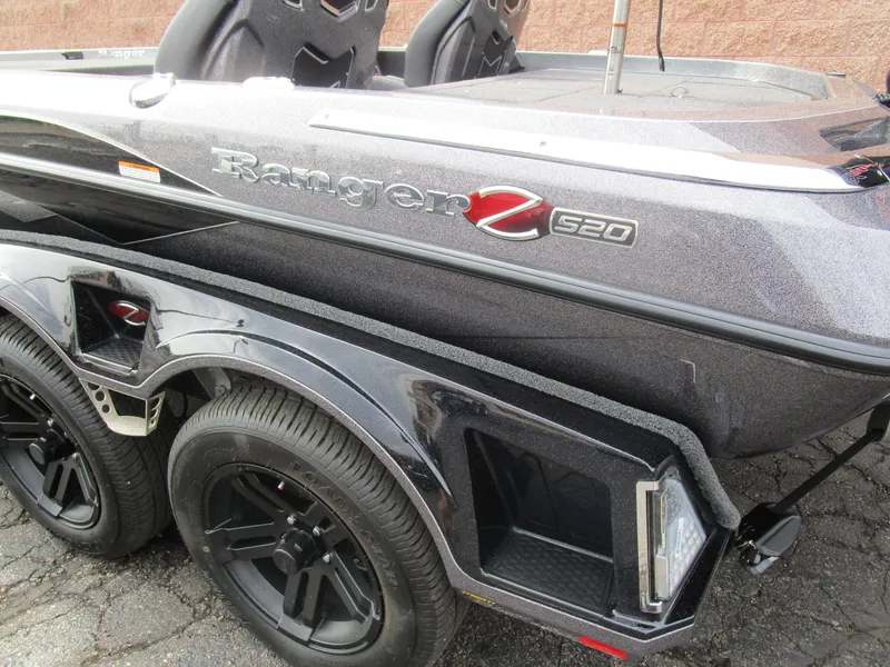 Slide: The Image of 2025 Ranger Z520 boat with sleek design and dual black wheels. - 18