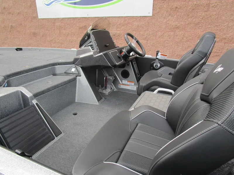 Slide: The Image of 2025 Ranger Z520 boat interior with sleek black seating and modern dashboard design. - 21