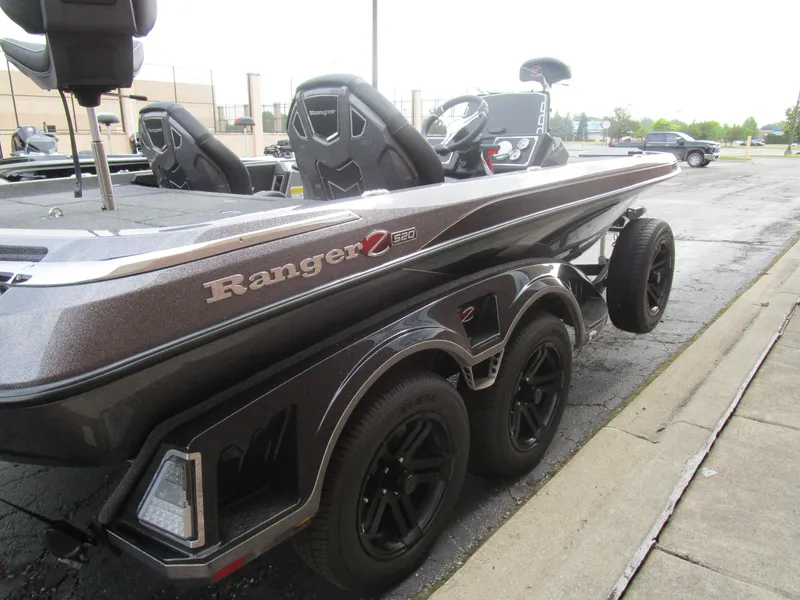 Slide: The Image of 2025 Ranger Z520 boat on trailer, featuring sleek design and modern seating. - 4