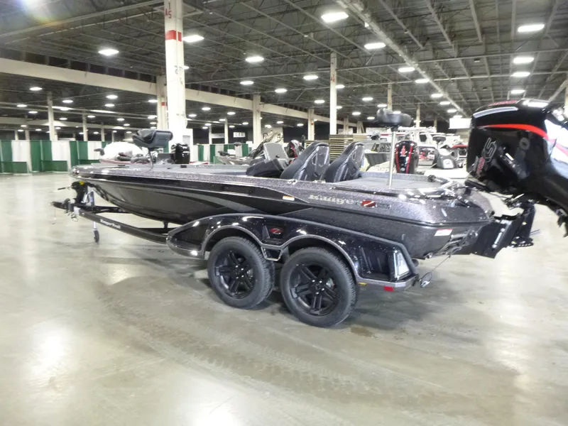 Slide: The Image of 2025 Ranger Z520 boat displayed indoors, featuring sleek design and dual-axle trailer. - 5
