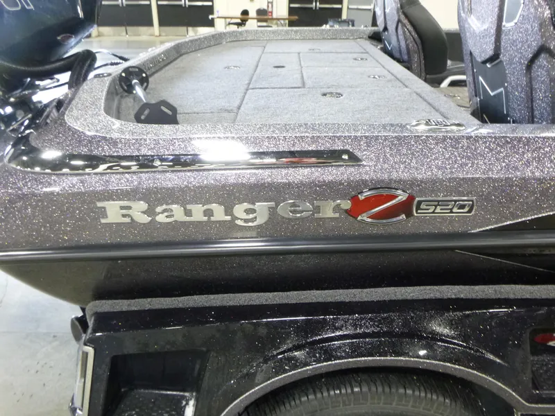 Slide: The Image of 2025 Ranger Z520 boat with sleek design and metallic finish. - 8