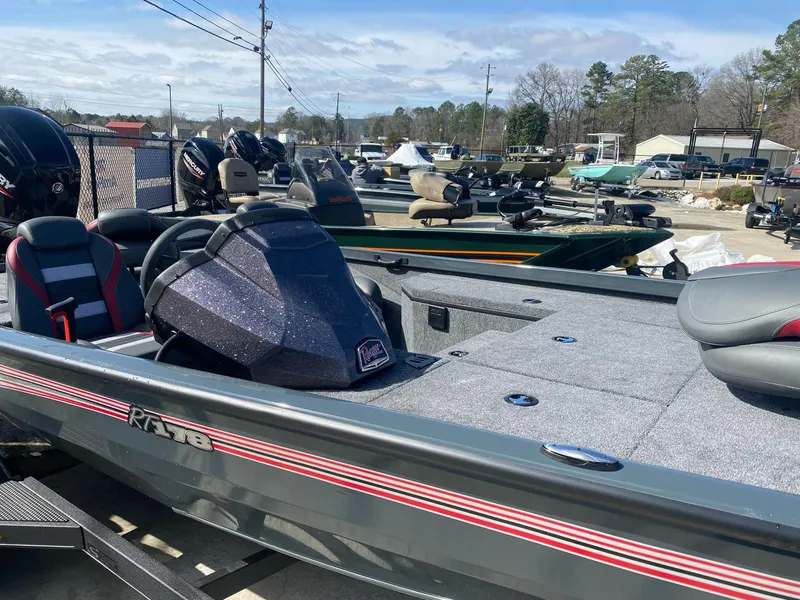 Slide: The Image of 2025 Ranger RT178 boat in a dealership lot, showcasing sleek design and modern features. - 3