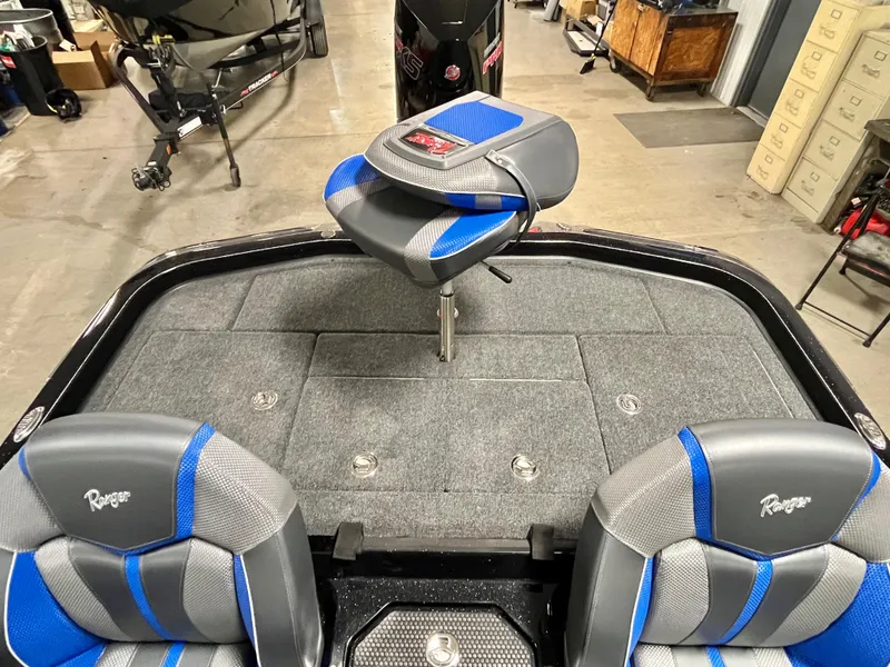 Slide: The Image of 2025 Ranger Z520 boat interior with storage compartments and branded seats. - 10