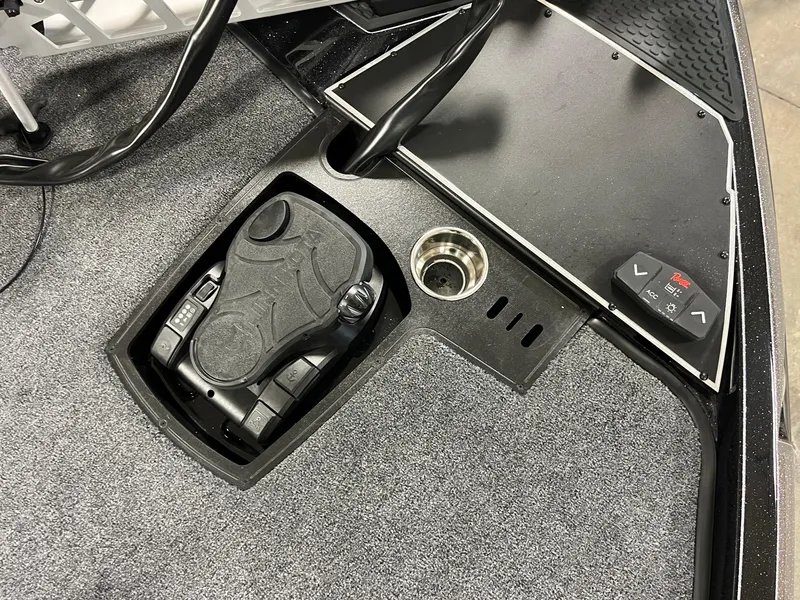 Slide: The Image of 2025 Ranger Z520 boat deck with trolling motor and foot pedal controls. - 16