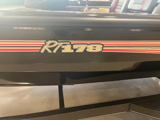 Slide: The Image of 2025 Ranger RT178 boat with red and white stripes on the side. - 1