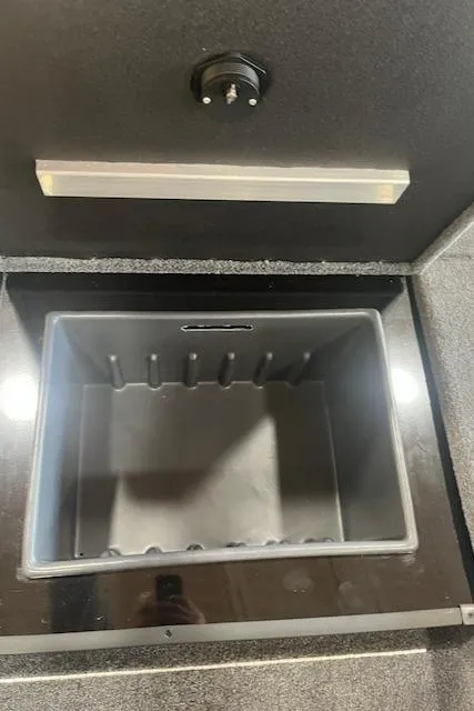 Slide: The Image of 2025 Ranger RT178 storage compartment with open lid, showcasing interior space. - 10