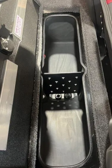 Slide: The Image of 2025 Ranger RT178 boat storage compartment with carpeted interior. - 11