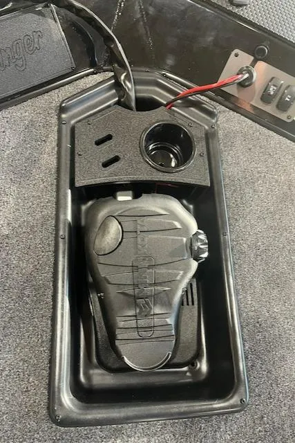 Slide: The Image of Ranger RT178 2025 boat foot pedal control on carpeted surface. - 12