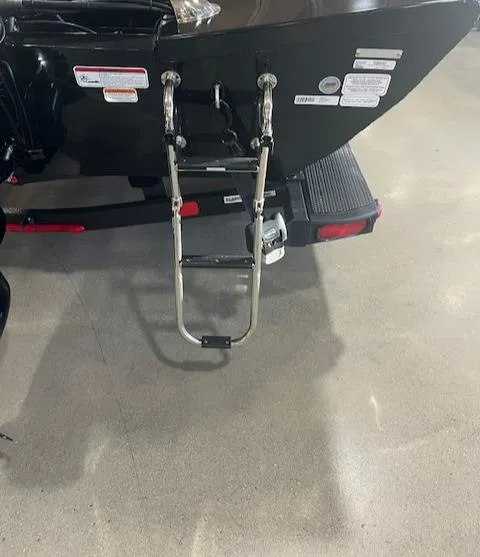 Slide: The Image of 2025 Ranger RT178 boat with rear ladder and safety labels. - 14