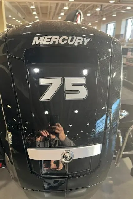 Slide: The Image of Mercury 75 outboard motor on 2025 Ranger RT178 boat in showroom. - 2