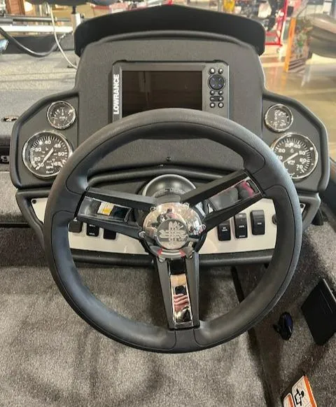 Slide: The Image of 2025 Ranger RT178 boat dashboard with steering wheel and gauges. - 4