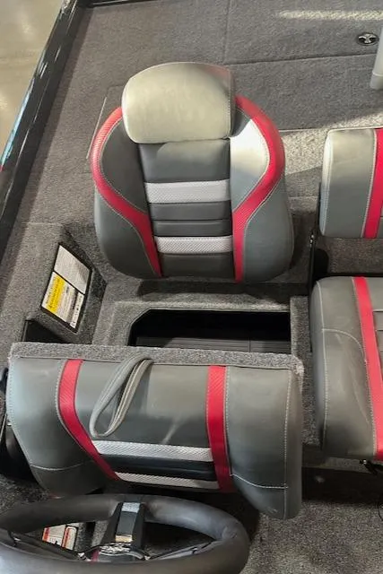 Slide: The Image of 2025 Ranger RT178 boat interior with gray and red seats. - 6