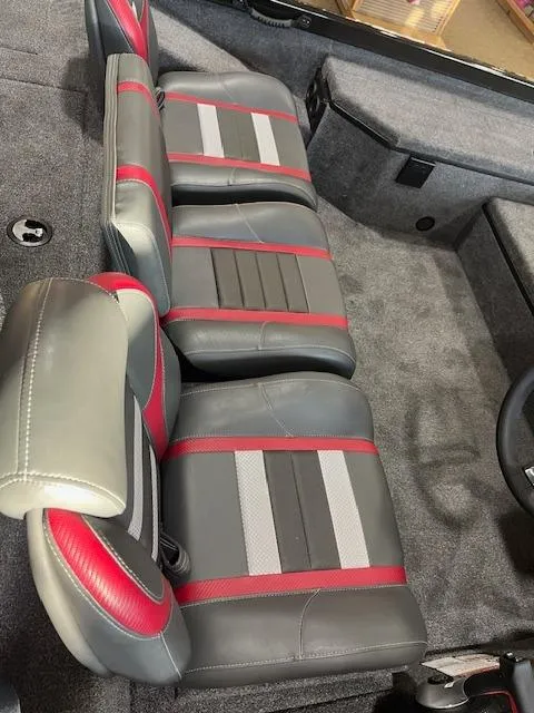 Slide: The Image of 2025 Ranger RT178 boat interior with gray and red seats. - 7