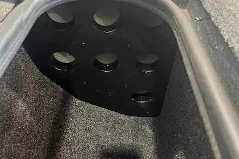 Slide: The Image of Interior view of 2025 Ranger RT178 boat compartment with circular cutouts. - 9