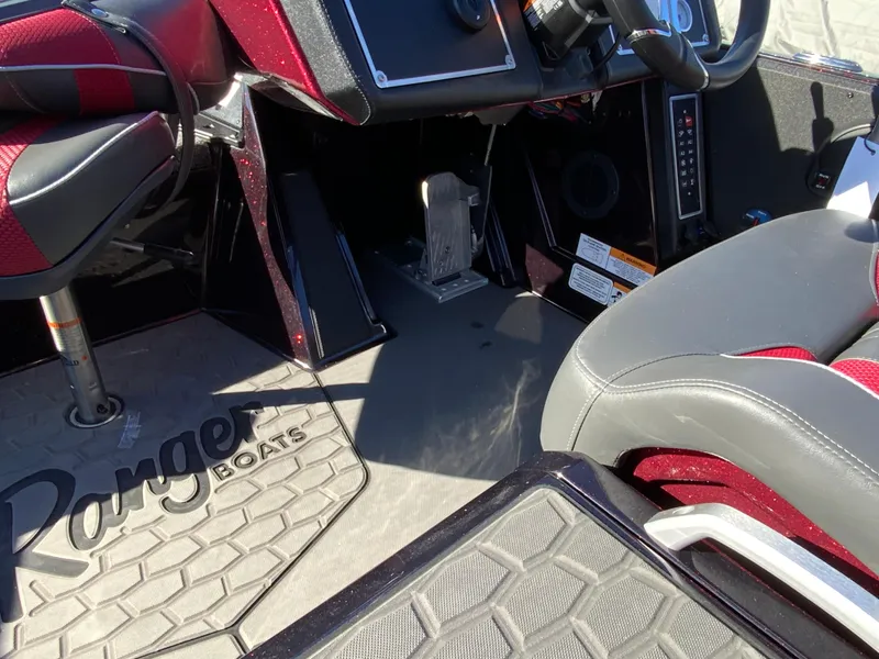 Slide: The Image of Interior of 2025 Ranger Z520 boat, featuring seating and control area. - 12