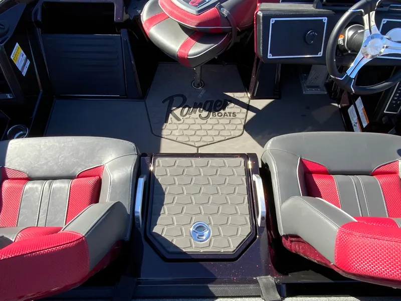 Slide: The Image of Interior of 2025 Ranger Z520 boat with red and gray seating and Ranger Boats logo. - 13
