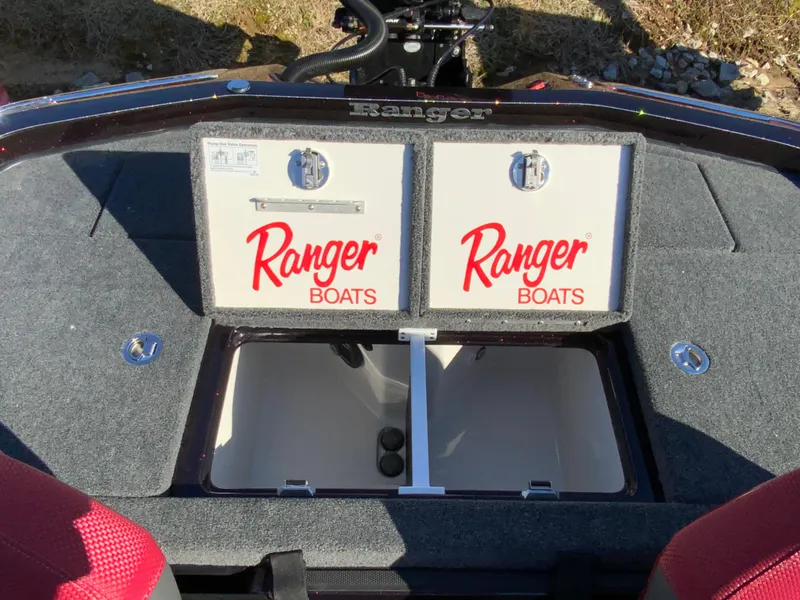 Slide: The Image of 2025 Ranger Z520 boat storage compartments with Ranger Boats branding. - 14