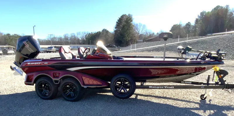 Slide: The Image of 2025 Ranger Z520 boat on trailer, parked outdoors, side view. - 16