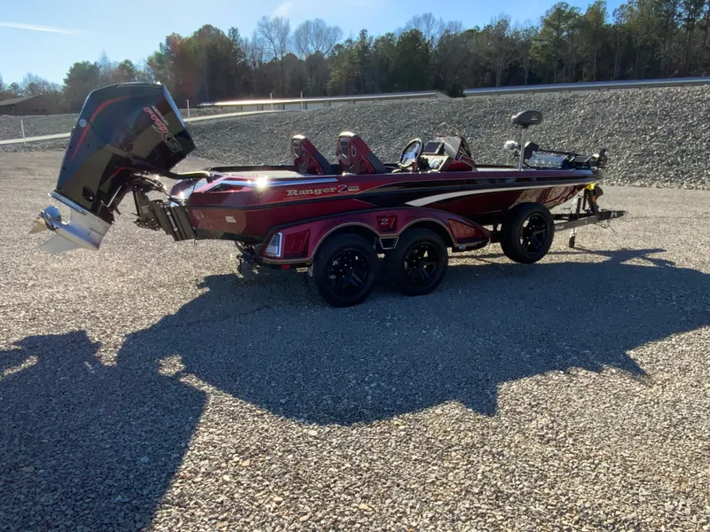 Slide: The Image of 2025 Ranger Z520 boat on trailer in sunny outdoor setting. - 17