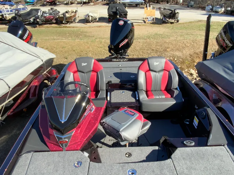 Slide: The Image of 2025 Ranger Z520 boat with red and gray seating, displayed outdoors. - 7