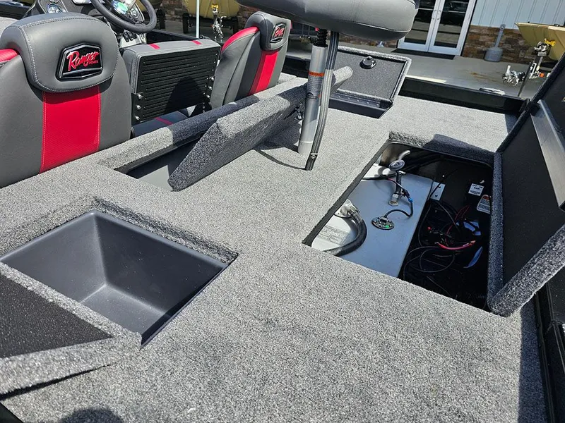 Slide: The Image of 2025 Ranger RT178 boat interior with storage compartments and seating. - 13