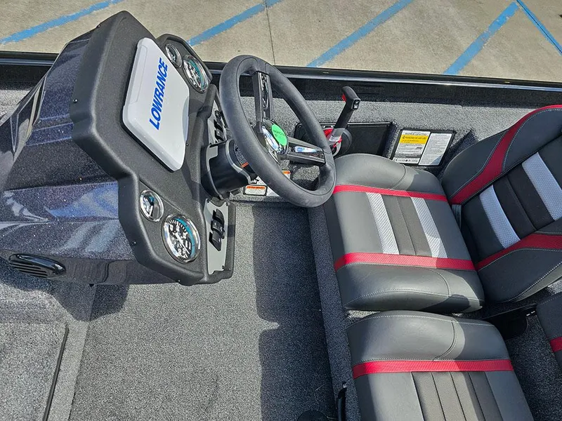 Slide: The Image of 2025 Ranger RT178 boat interior with steering wheel and dual seats. - 14