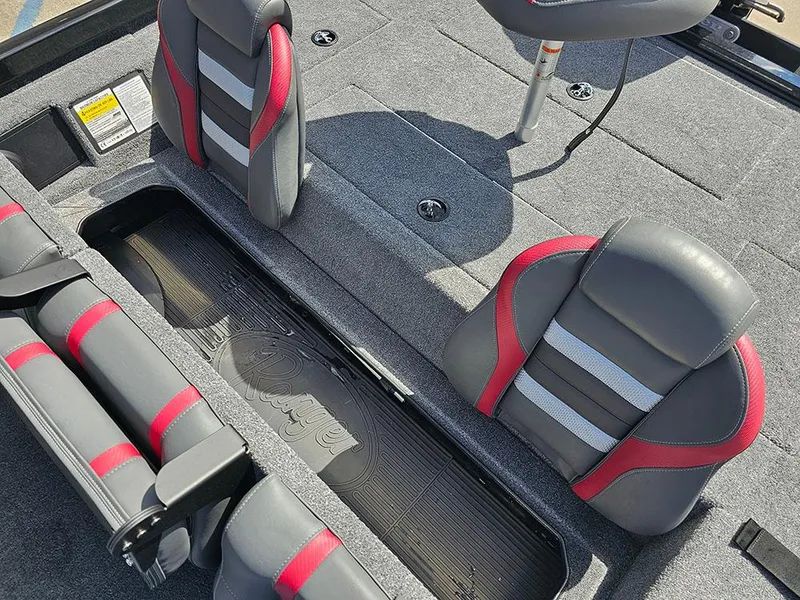 Slide: The Image of 2025 Ranger RT178 boat interior with gray and red seats, open storage compartment. - 17