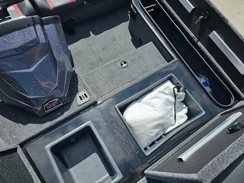 Slide: The Image of 2025 Ranger RT178 boat interior with storage compartments and seating. - 20