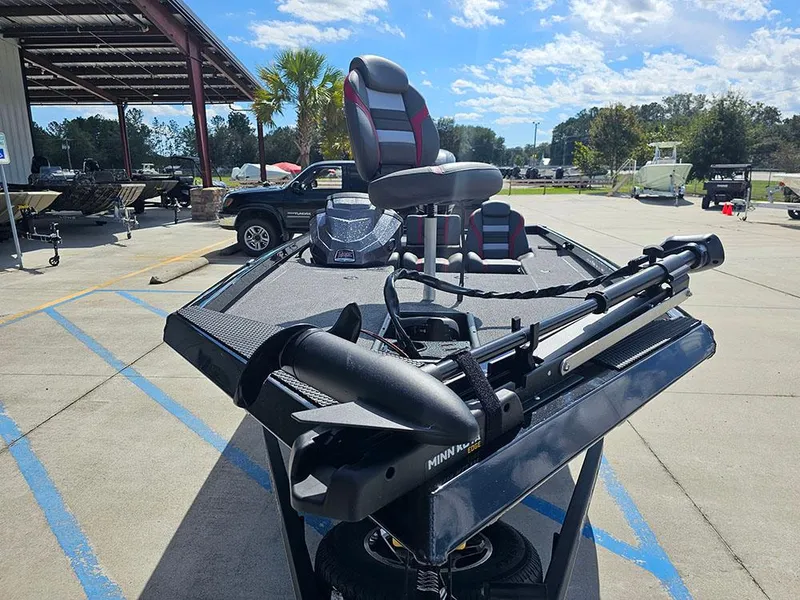 Slide: The Image of 2025 Ranger RT178 fishing boat with trolling motor and seating, displayed outdoors. - 4
