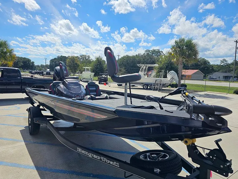 Slide: The Image of 2025 Ranger RT178 boat on trailer under sunny sky. - 5
