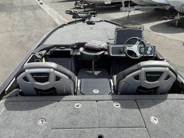 Slide: The Image of 2025 Ranger Z520 boat interior with dual seats and steering console. - 7