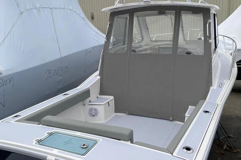 Slide: The Image of 2025 NorthCoast 235 HT boat with enclosed cabin and spacious deck. - 8