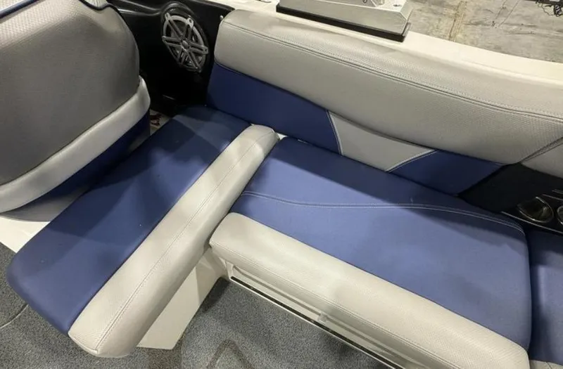 Slide: The Image of 2016 MasterCraft X46 boat interior with blue and gray seating. - 14
