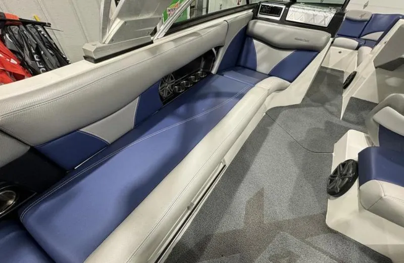 Slide: The Image of 2016 MasterCraft X46 interior with blue and gray seating, modern design. - 15