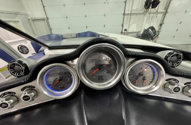 Slide: The Image of Dashboard of a 2016 MasterCraft X46 boat with gauges and controls. - 21