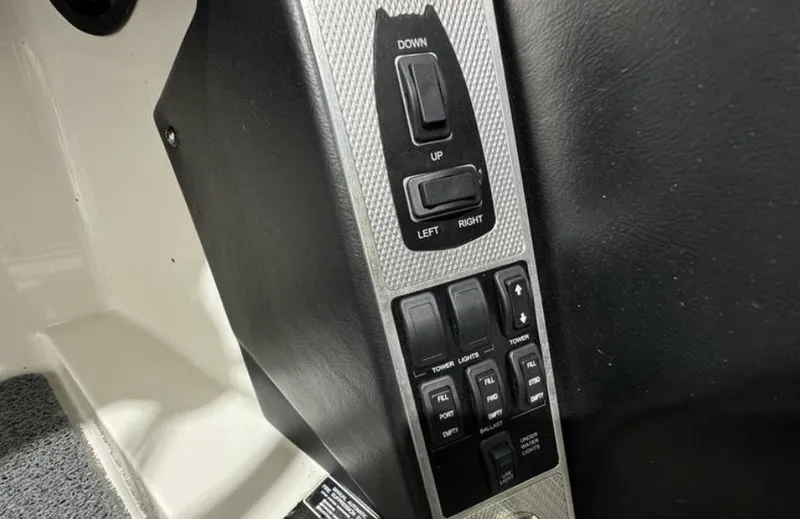 Slide: The Image of Control panel of a 2016 MasterCraft X46 boat with switches and buttons. - 22