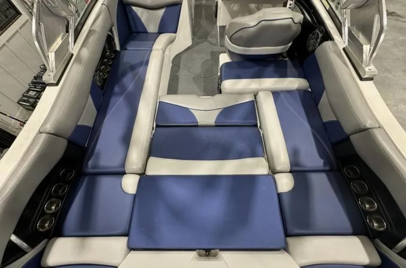 Slide: The Image of 2016 MasterCraft X46 boat interior with blue and white seating. - 25