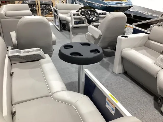 Slide: The Image of Interior of 2025 Godfrey Xperience 2286 SBX pontoon boat with seating and table. - 13