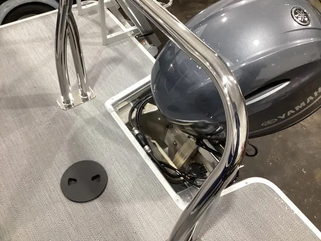 Slide: The Image of 2025 Godfrey Xperience 2286 SBX boat with Yamaha engine, featuring sleek metal railings. - 14